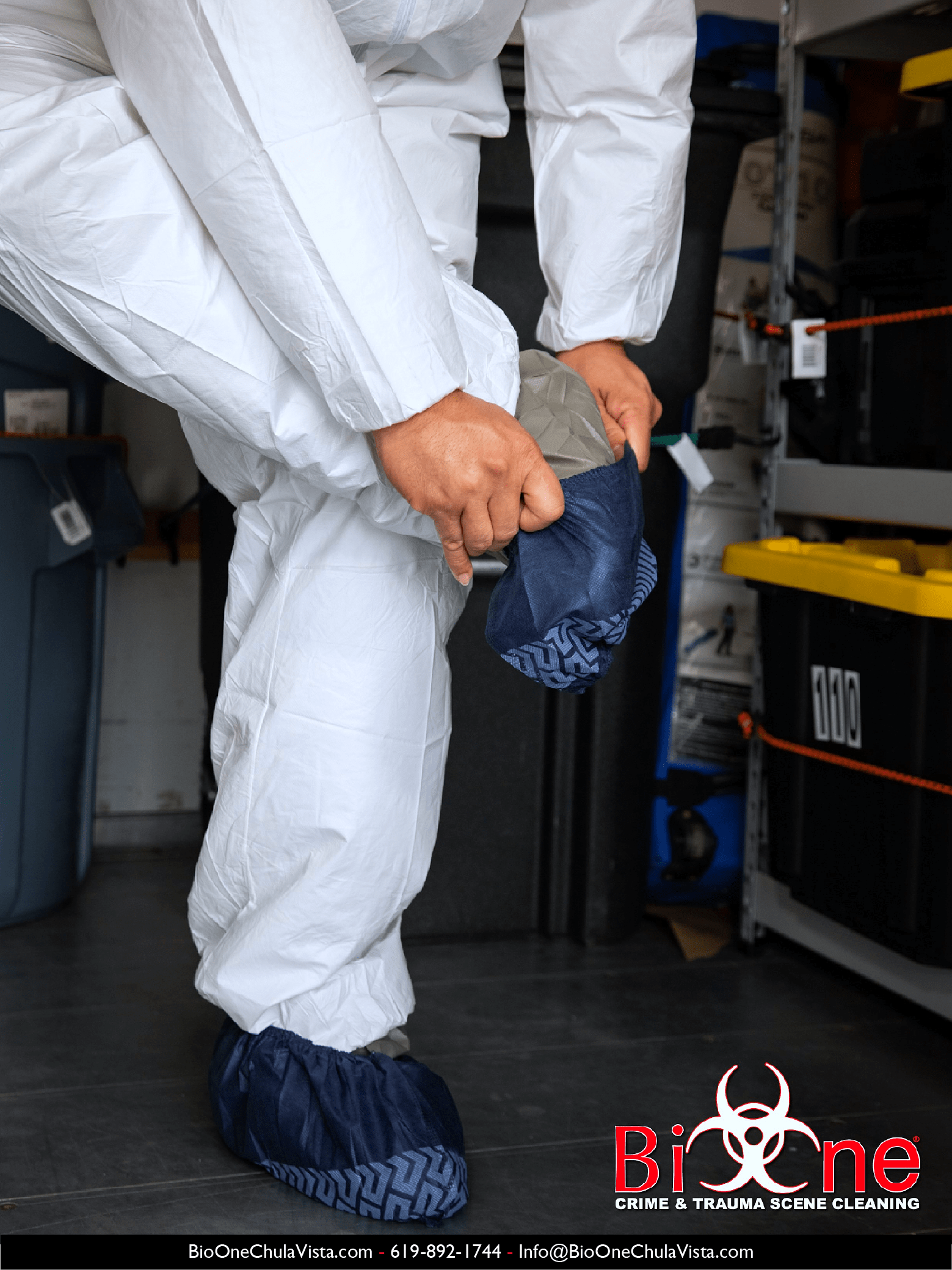 Image shows Bio-One technician dressing in PPE (shoe covers).