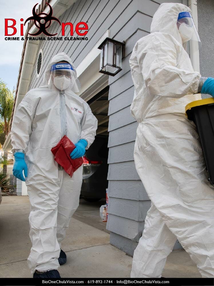 Bio-One technicians dressed in hazmat disposing of biohazardous waste. Photo credit: Bio-One of Chula Vista.