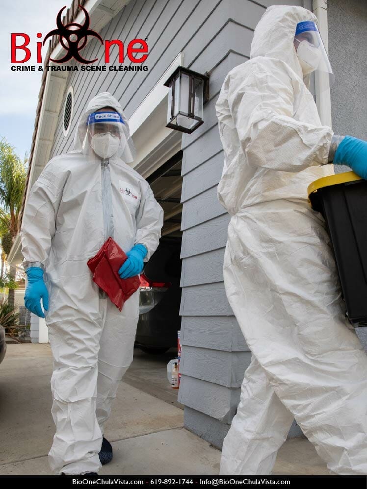 Bio-One technicians carrying biohazardous waste. Photo credit: Bio-One of Chula Vista.