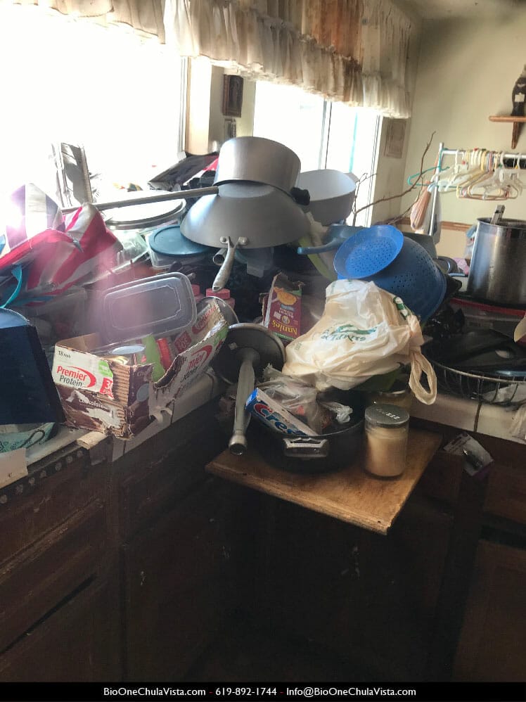Inside of a hoarded home - Cluttered kitchen. Photo credit: Bio-One Chula Vista.