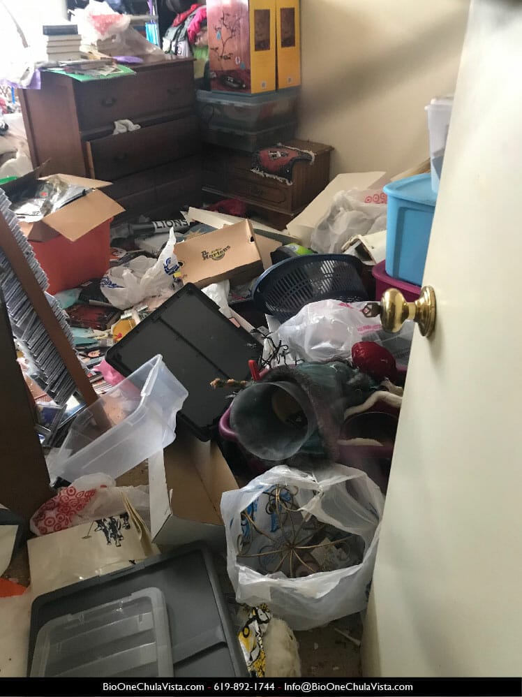 Inside of a hoarded home - Bedroom. Photo credit: Bio-One Chula Vista.