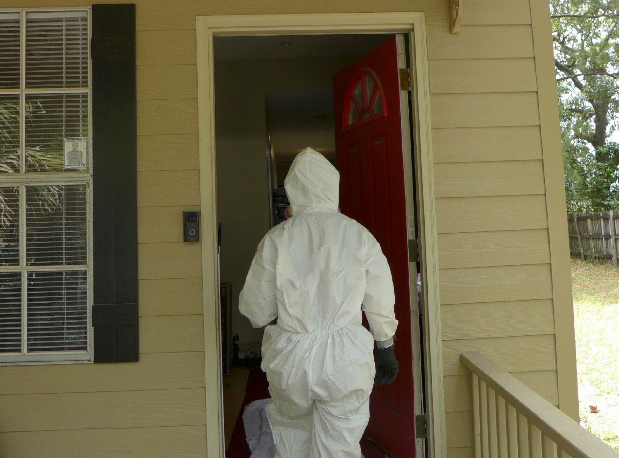 Bio-One remediation technician entering a hoarded home